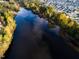 Aerial view of lake reflecting the blue sky at 265 Hank Way, Angier, NC 27501