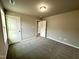 Empty bedroom with gray carpet, white door, and neutral walls at 438 Earnest Way # L29, Kenly, NC 27542