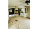 Open kitchen and dining area with white cabinets, an island, and a ceiling fan at 461 Clay Thomas Rd, Roxboro, NC 27573