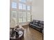 Bright living room featuring high ceilings, ample windows, and hardwood floors at 5328 Bent Leaf Dr, Raleigh, NC 27606