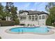 Backyard oasis with inviting pool, hot tub, and lounge chairs at 5328 Bent Leaf Dr, Raleigh, NC 27606