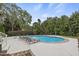 Tranquil pool area surrounded by lush greenery and palm trees at 5328 Bent Leaf Dr, Raleigh, NC 27606