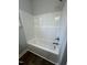 Clean bathroom featuring a bathtub and updated fixtures at 601 Vannoy Pl, Fuquay Varina, NC 27526