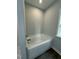 Bathroom with soaking tub and gray walls at 601 Vannoy Pl, Fuquay Varina, NC 27526