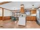 Eat-in kitchen with wooden cabinets, granite countertops, and stainless steel appliances at 713 Cooke Rd, Louisburg, NC 27549