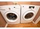 Laundry room equipped with a front-load washer and dryer at 8325 Neuse Grove Ln, Raleigh, NC 27616