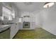 View of the kitchen with white cabinets, green oven, and linoleum flooring at 920 Essex Dr, Graham, NC 27253