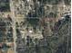 An aerial view of the property with a red outline marking its boundary at 923 Sunny Ln, Raleigh, NC 27603