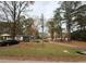 One-story house situated on a corner lot with trees at 923 Sunny Ln, Raleigh, NC 27603