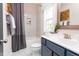Guest bathroom with a shower/tub combo, vanity, and tiled floor at 9520 Wood River Dr, Zebulon, NC 27597