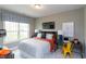 A cozy bedroom with a bed, desk, and stylish decor at 9520 Wood River Dr, Zebulon, NC 27597