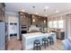 Sleek kitchen featuring ample cabinet storage, an island, stainless steel appliances, and a breakfast bar at 9520 Wood River Dr, Zebulon, NC 27597