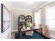 Home office or study with elegant cabinetry, a large desk, and decorative curtains at 9520 Wood River Dr, Zebulon, NC 27597