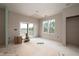 Unfinished dining room with windows and sliding glass door at 968 Duke Memorial Rd, Spring Hope, NC 27882