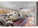 Living room with a ceiling fan, hardwood floors, and open concept design at 1105 Ventnor Pl, Cary, NC 27519