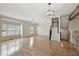 Spacious living room with hardwood floors, bay windows, and staircase at 11817 Canemount St, Raleigh, NC 27614