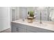 Modern bathroom with a double vanity, glass shower enclosure, and ample lighting at 119 Ethel Ln, Angier, NC 27501