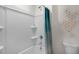 Clean bathroom with shower/tub combo, white fixtures, and modern wall art at 119 Ethel Ln, Angier, NC 27501