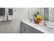 Modern bathroom with double vanity, white countertop, and gray cabinets at 119 Ethel Ln, Angier, NC 27501