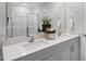 Spacious bathroom featuring a double vanity with white countertop and a large mirror at 119 Ethel Ln, Angier, NC 27501