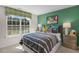 Inviting bedroom with striped bedding and a bright window at 119 Ethel Ln, Angier, NC 27501