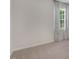 Spacious bedroom with carpet, large window with curtains, and neutral decor at 119 Ethel Ln, Angier, NC 27501