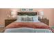 Cozy bedroom with wooden headboard, matching nightstands, and stylish decor at 119 Ethel Ln, Angier, NC 27501