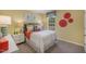 Bright, cheerful bedroom with yellow walls and whimsical decor at 119 Ethel Ln, Angier, NC 27501