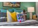 Close-up of a bed with colorful pillows and modern decor at 119 Ethel Ln, Angier, NC 27501