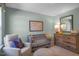 Baby's Bedroom with crib, armchair, dresser, and world map at 119 Ethel Ln, Angier, NC 27501