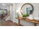 View of the entryway and staircase with wood flooring and decorative accents at 119 Ethel Ln, Angier, NC 27501