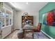 Inviting home office with ample natural light, patterned curtains, and comfortable seating at 119 Ethel Ln, Angier, NC 27501