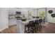 Open-concept kitchen and dining area with granite countertops, an island, and access to backyard at 119 Ethel Ln, Angier, NC 27501