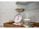 Kitchen detail showcasing vintage-style scale and cookbook at 119 Ethel Ln, Angier, NC 27501