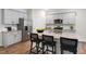 Modern kitchen featuring stainless steel appliances, ample counter space, and an island with bar seating at 119 Ethel Ln, Angier, NC 27501