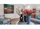 Open living area with modern decor, wood floors, and view of the kitchen at 119 Ethel Ln, Angier, NC 27501