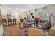 Living area with open floor plan to the kitchen, dining space and staircase at 119 Ethel Ln, Angier, NC 27501