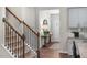 Staircase with wood railing and metal balusters, leading to the second floor at 119 Ethel Ln, Angier, NC 27501