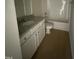 Clean and bright bathroom with white cabinets, granite countertop, and a shower/tub combo at 193 Magnolia Run Way, Benson, NC 27504
