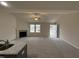 Open living room with vaulted ceiling, fireplace, carpet flooring, and natural light at 193 Magnolia Run Way, Benson, NC 27504
