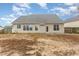 Fenced backyard with a small patio and some patchy grass at 2204 Regent Ct, Creedmoor, NC 27522