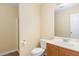 Clean bathroom with shower, toilet, and vanity with oak wood cabinets at 2204 Regent Ct, Creedmoor, NC 27522