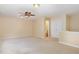 Spacious bedroom with ceiling fan, carpeted flooring, and attached bathroom at 2204 Regent Ct, Creedmoor, NC 27522