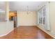 Dining area with hardwood floors, chandelier, and large window at 2204 Regent Ct, Creedmoor, NC 27522