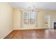 Dining area with hardwood floors, large window with curtains, and a chandelier at 2204 Regent Ct, Creedmoor, NC 27522
