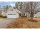 Charming two-story home with a two-car garage, paved driveway, and landscaping at 2204 Regent Ct, Creedmoor, NC 27522