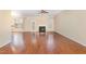 Spacious living room with hardwood floors, fireplace, ceiling fan, and natural light at 2204 Regent Ct, Creedmoor, NC 27522