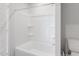 Clean bathroom featuring a bright white bathtub, shower, and toilet at 228 Maggie Ln, Roxboro, NC 27573