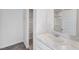 Modern bathroom with white vanity, marble countertop, and built-in linen shelves at 228 Maggie Ln, Roxboro, NC 27573