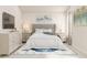 Bedroom with tufted headboard, matching nightstands, a dresser, and a blue area rug at 228 Maggie Ln, Roxboro, NC 27573